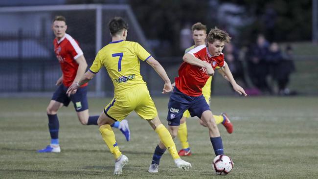 South Hobart’s Bradley Lakoseljac takes on Devonport’s Daniel Syson. Picture: PATRICK GEE