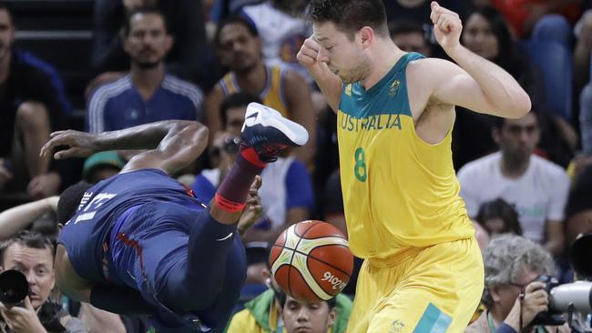 United States' Paul George (13) and Australia's Matthew Dellavedova.