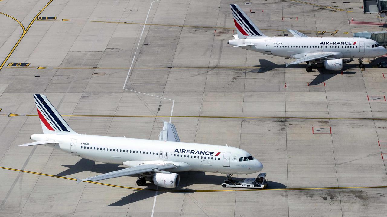 Air France planes at Roissy-Charles de Gaulle Airport, north of Paris. (Photo by JOEL SAGET / AFP)