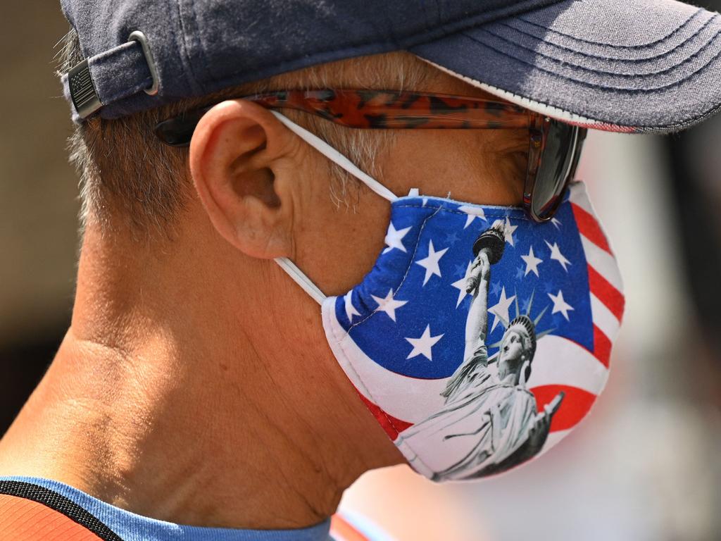 America has moved towards a policy of accepting Covid-19 as part of everyday life. Mask-wearing became a political battleground in the United States in the early days of the pandemic, but the CDC says masks are now no longer required indoors. Picture: AFP