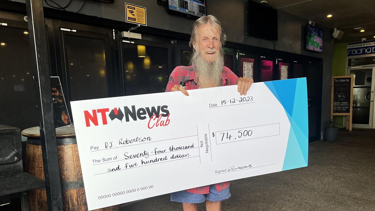 Sunday Territorian bingo winner DJ Robertson with his cheque for $74,500 at Parap Tavern.