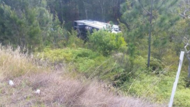 The truck rests on its side after sliding down the embarkment. Picture: Facebook