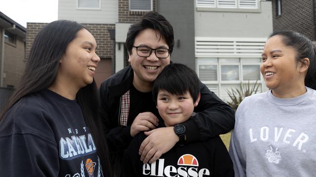 New home owners Jan and Ceilene Catarroja with their children Grace and Lucas outside of their home in Riverstone, Sydney. Picture: Nikki Short