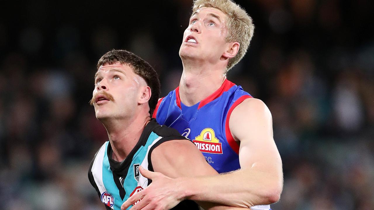 Peter Ladhams, pictured against Tim English in his Port Adelaide days, is poised to play his first game for the Swans next week. Picture: Getty Images