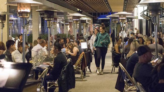 People out and about at restaurants on the Barangaroo water front. Sydney. Picture: Damian Shaw