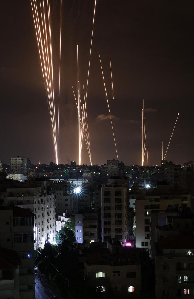 A salvo of rockets is fired by Palestinian militants from Gaza City toward Israel. Picture: AFP