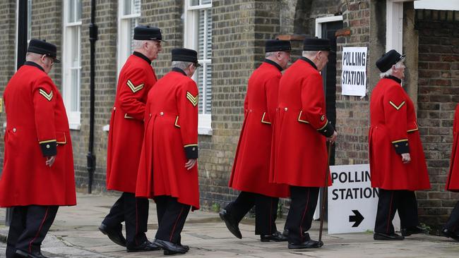 Chelsea pensioners arrive at a polling station near to the Royal Chelsea Hospital, London, to vote. Picture: AP