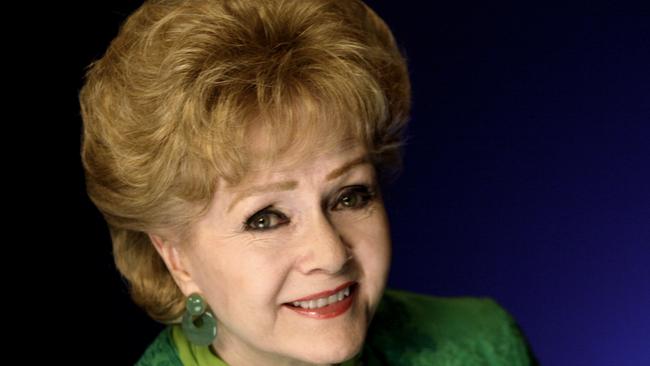 FILE - This Oct. 14, 2011 file photo shows actress Debbie Reynolds posing for a portrait in New York. The Los Angeles Times and celebrity website TMZ have reported that Reynolds has been rushed to the hospital Wednesday, Dec. 28, 2016, after suffering a medical emergency in Los Angeles one day after her daughter Carrie Fisher died. (AP Photo/Richard Drew, File)