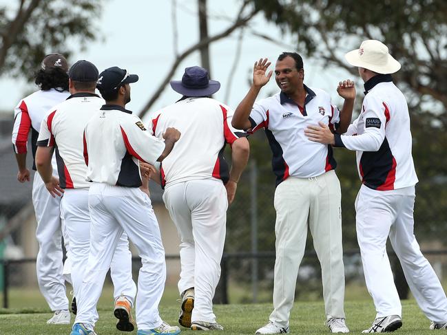 Diggers Rest Bulla players celebrate a run out. Picture: Hamish Blair