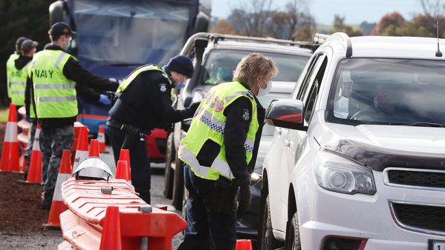 Police and ADF operate a roadblock on the Calder Freeway. Picture: NCA NewsWire/David Crosling