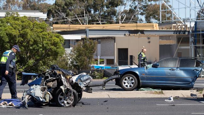 Police investigating the wrecked BMW. Picture: Sarah Matray