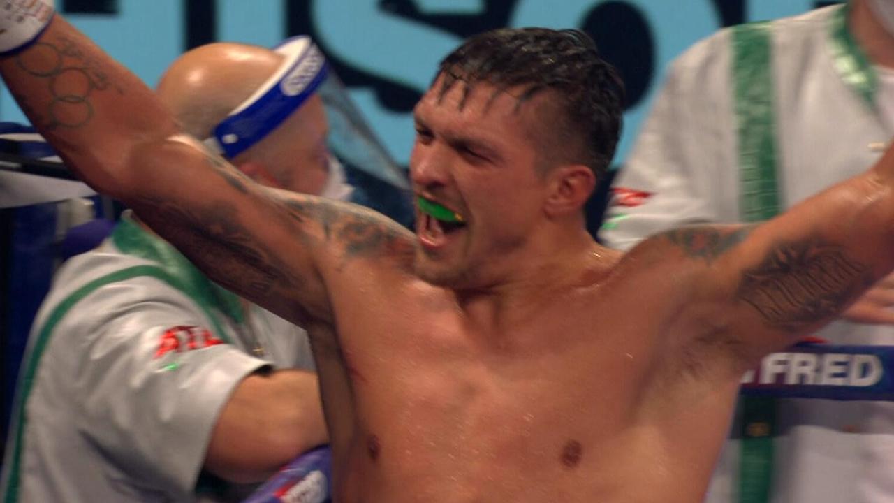 Usyk celebrates his effort in the ring.