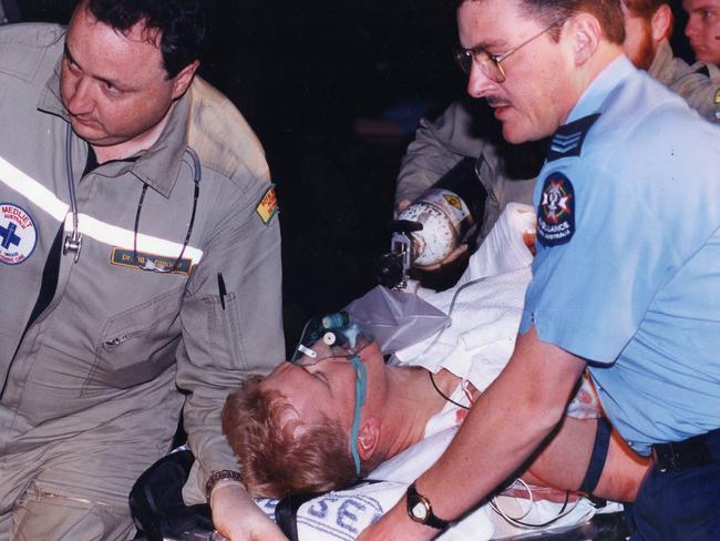 STAR Group officer Derrick McManus, who was shot multiple times by gunman Tony Grosser, is lifted out of the rescue helicopter at Victoria Park in 1994.