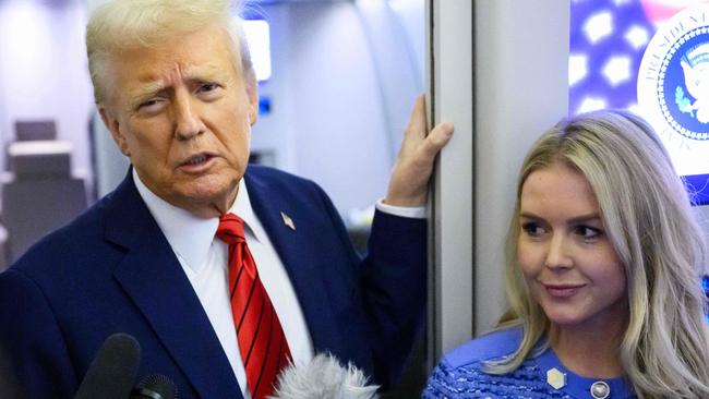 Donald Trump, watched by White House Press Secretary Karoline Leavitt, speaks to reporters. Picture: AFP.