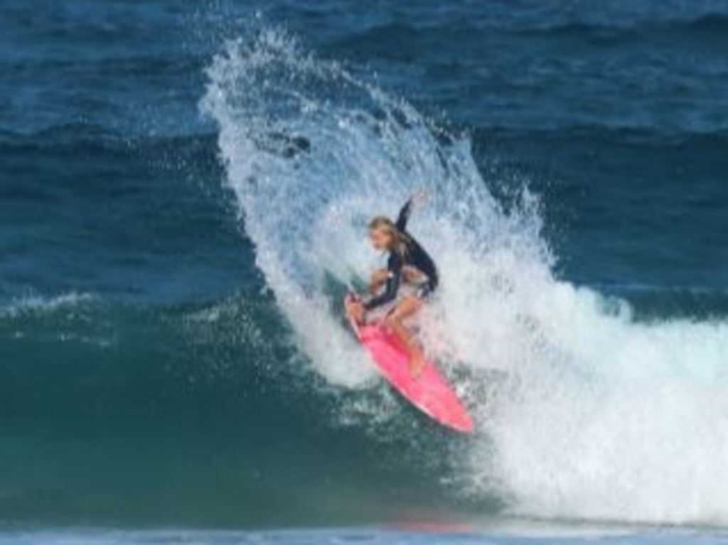 Meika Locke surfing.