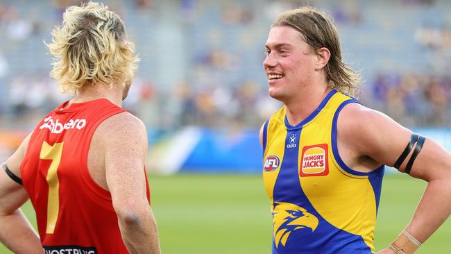 Nick Holman of the Suns chats with Harley Reid after the final siren. Photo by Janelle St Pierre/AFL Photos via Getty Images.