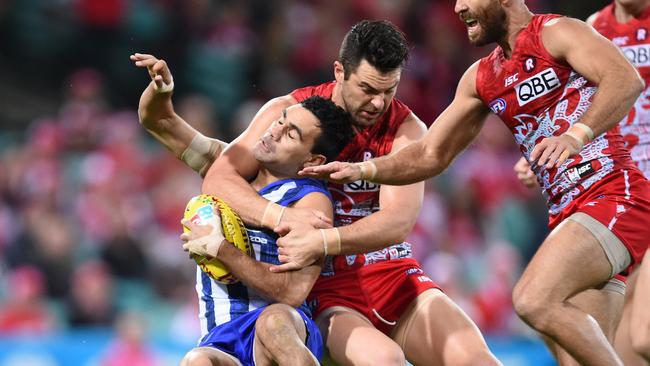 Heath Grundy of the Swans is penalised for this high tackle on Lindsay Thomas of the Kangaroos during the Round 10 AFL match between the Sydney Swans and the North Melbourne Kangaroos at the Sydney Cricket Ground in Sydney, Friday, May 27, 2016. (AAP Image/Dean Lewins) NO ARCHIVING, EDITORIAL USE ONLY