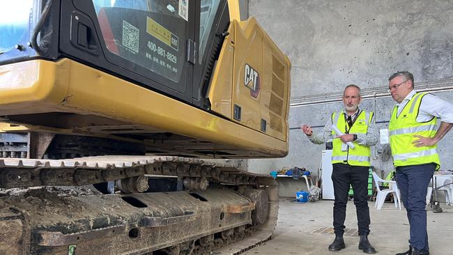 Federal Agriculture Minister Murray Watt (right) inspecting a highly contaminated digger imported from China that will be sent back.