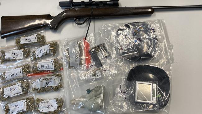 Weapons and drugs were seized by police during two search warrants carried out across Logan. Picture: QPS