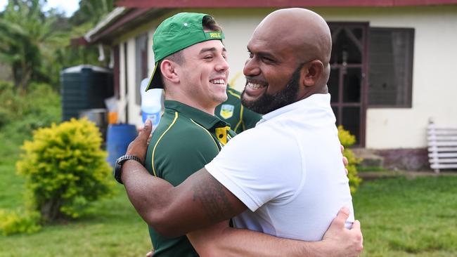 Reed Mahoney is greeted by Maika Sivo's cousin, Atu. Photo: Nathan Hopkins/NRL Photos