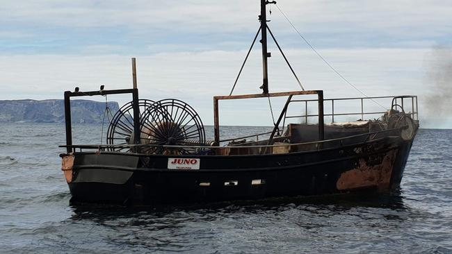 The fishing boat that caught fire near Port Arthur. Picture: ROBERT PENNICOTT