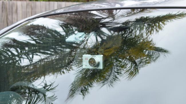 Picture of a dashcam, mounted on to the windscreen.