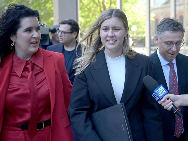 Brittany Higgins leaves Federal Court alongside lawyer Leon Zwier and friend Emma Webster - both of whom were in the secret recording. Picture: NCA NewsWire / Jeremy Piper