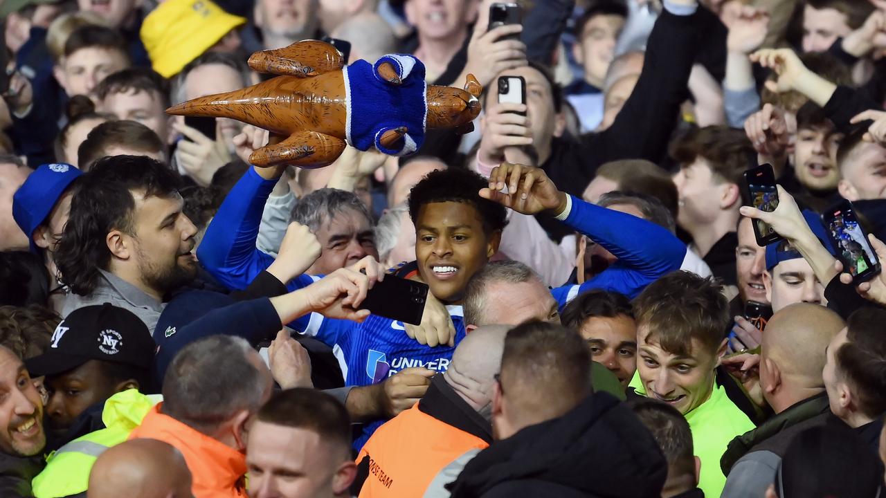 Kusini Yengi celebrates after helping Portsmouth secure the League One title. (Photo by Alex Davidson/Getty Images)