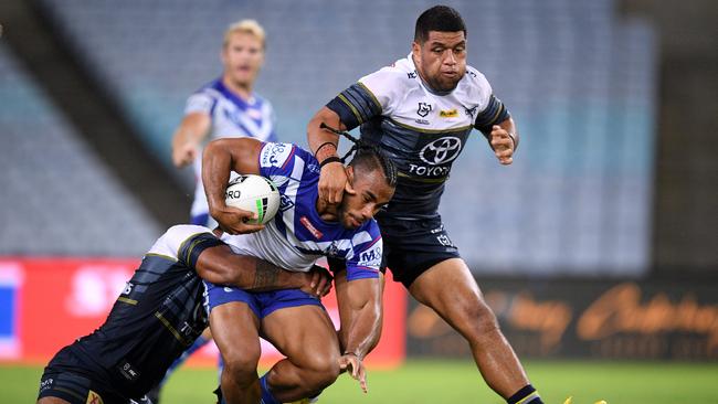 The Cowboys’ John Asiata (right) helps bring down Christian Crichton in round two. Asiata’s North Queensland deal expires at season’s end. Picture: AAP Image/Dan Himbrechts