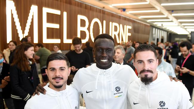 MELBOURNE, AUSTRALIA - DECEMBER 05: Marco Tilio, Thomas Deng and Jamie Maclaren of the Socceroos after arriving at Melbourne Airport. Pics: Morgan Hancock/Getty Images)