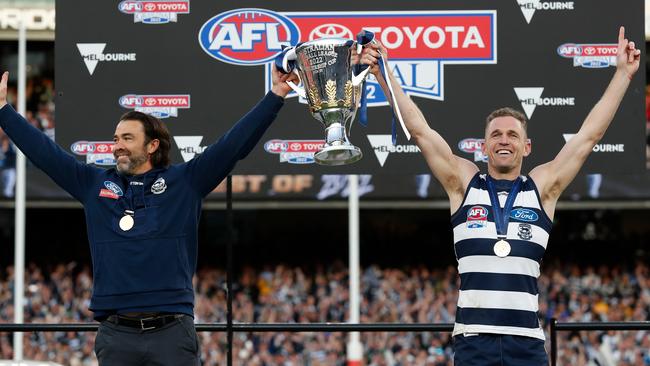 Chris Scott and Joel Selwood hold the cup aloft.