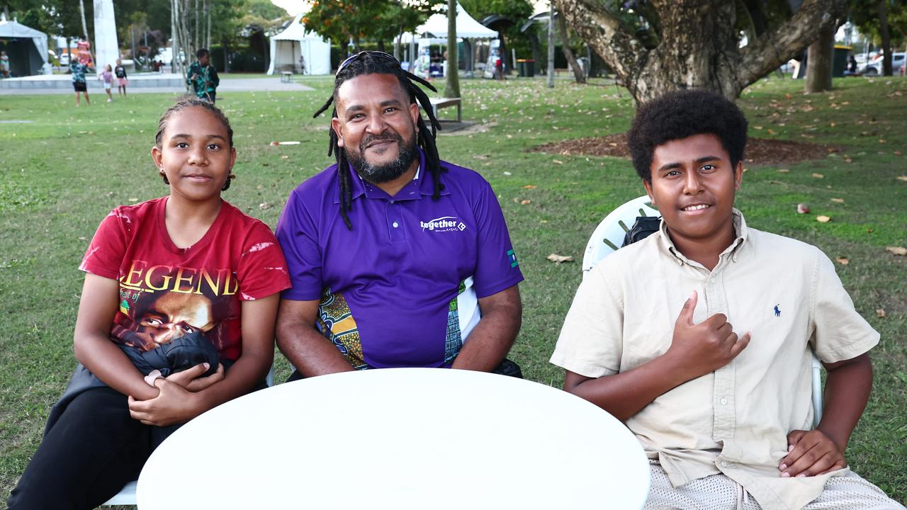 Ikasa Mosby, 12, Cyessie Mosby and Genia Mosby, 14, at the 17th Big Talk One Fire festival, held at Munro Martin Parklands. Picture: Brendan Radke