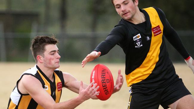 Benjamin Watson (Upwey Tecoma) competes for the ball against Christian Cameron (Woori Yallock)  Picture: Hamish Blair