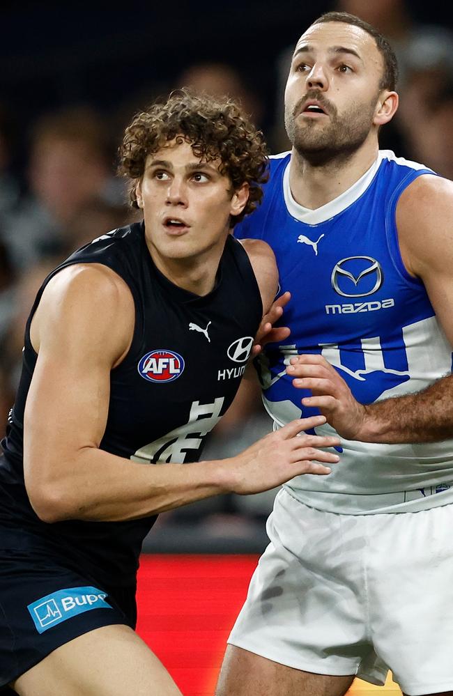 Charlie Curnow and Griffin Logue grapple on Sunday. Picture: Michael Willson/AFL Photos via Getty Images.