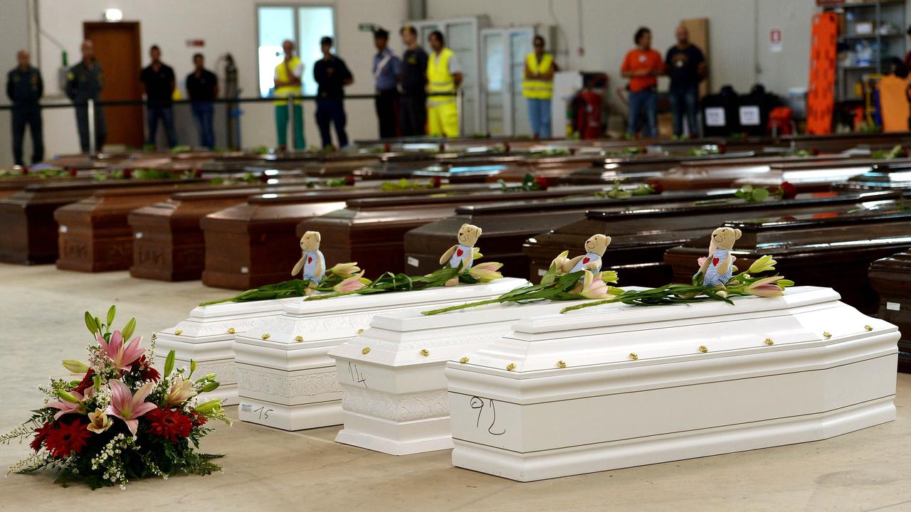 Coffins of children are pictured among Coffins of victims in an hangar of Lampedusa airport on October 5, 2013 after a boat with migrants sank killing more than 300 people. Picture: Alberto Pizzoli/AFP