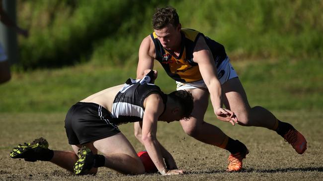 NFL: Josh Mills of Montmorency is tackled by Hurstbridge’s Joel Naylor. Picture: Hamish Blair