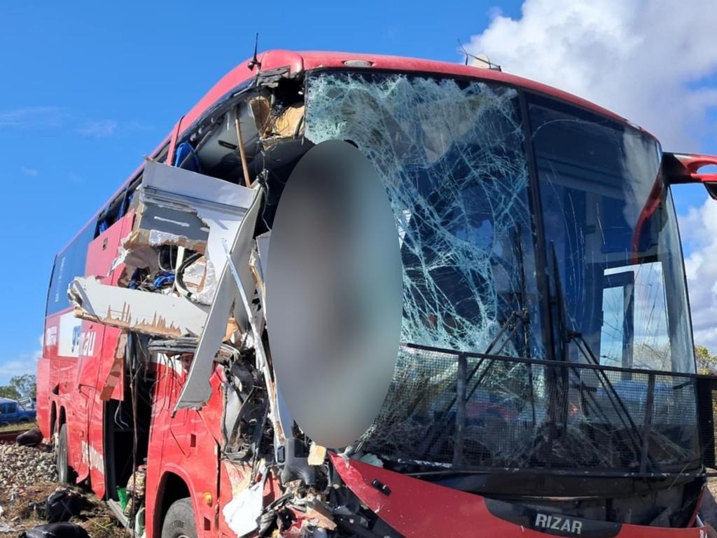 Photographs taken in the immediate aftermath of a horror fatal Greyhound passenger bus crash at Gumlu on the Bruce Highway south of Ayr on Sunday. The bus driver, picture, miraculously survived. The bus carrying 33 passengers was travelling north when it collided head on with a caravan being towed by a four-wheel drive driven by an elderly couple. Three passengers on the bus were killed while two others remained in critical conditions in Townsville University Hospital on Monday morning. Picture: Supplied