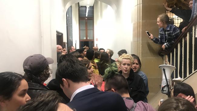 Protesters blocking the entrance to a talk by Bettina Arndt at Sydney University in 2018.