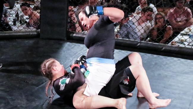 Winter Paralympian Mel Perrine during a cage fight. Picture: Brett Zimmer