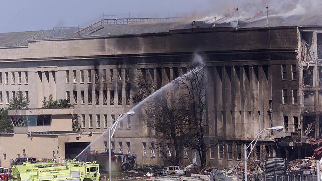 An emergency vehicle fights a fire at the Pentagon in Washington, DC, hours after a hijacked aeroplane crashed into the Pentagon. Picture: AFP