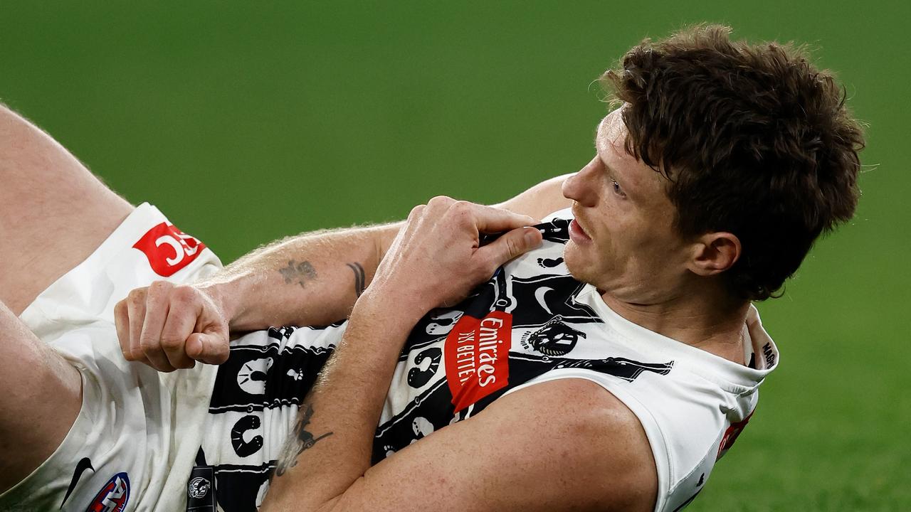 MELBOURNE, AUSTRALIA - JULY 05: Brody Mihocek of the Magpies is seen injured during the 2024 AFL Round 17 match between the Collingwood Magpies and the Essendon Bombers at Melbourne Cricket Ground on July 05, 2024 in Melbourne, Australia. (Photo by Michael Willson/AFL Photos via Getty Images)