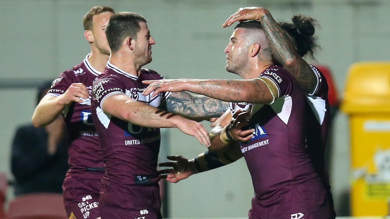 Joel Thompson celebrates scoring a try against the Eels.