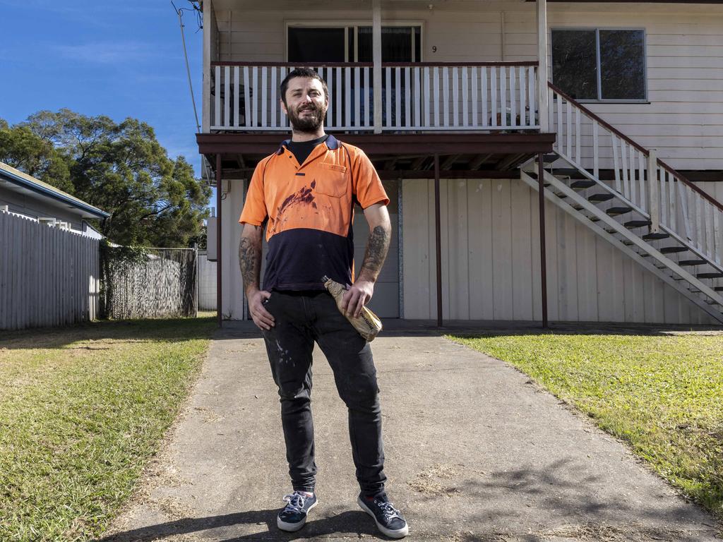 Alexander Hughes (29) at his rental property on Corella Street, Rocklea said the street had been ‘eerily quiet’ in the aftermath of the February floods. Picture: Matthew Poon.