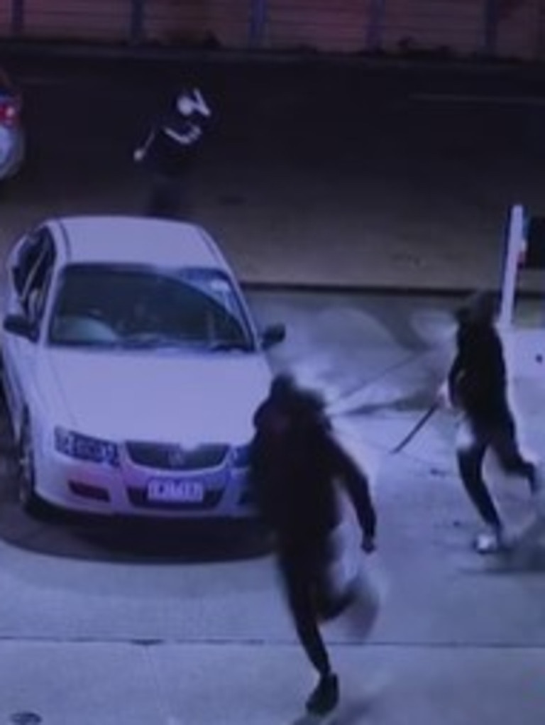 The attackers were wearing balaclavas and were each holding a machete. Picture: 7NEWS