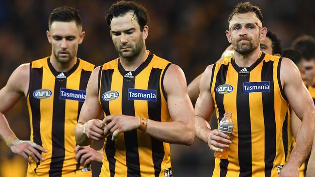 A disappointed Jack Gunston, Jordan Lewis and Luke Hodge.