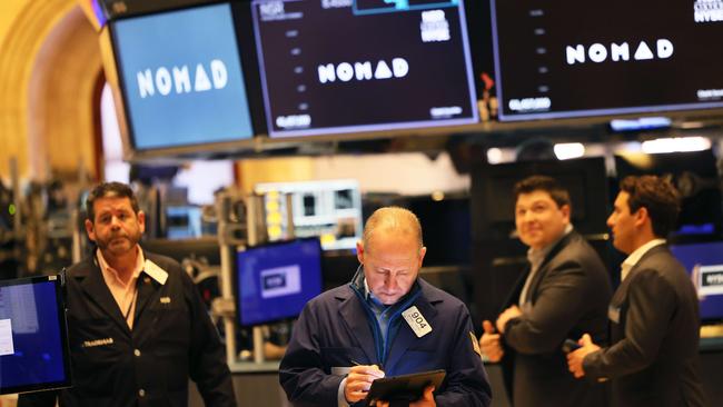 Traders work the floor of the New York Stock Exchange on a day that saw the Nasdaq plunge 5 per cent and more than 1000 points erased from the Dow. Picture: Michael M. Santiago/Getty Images/AFP