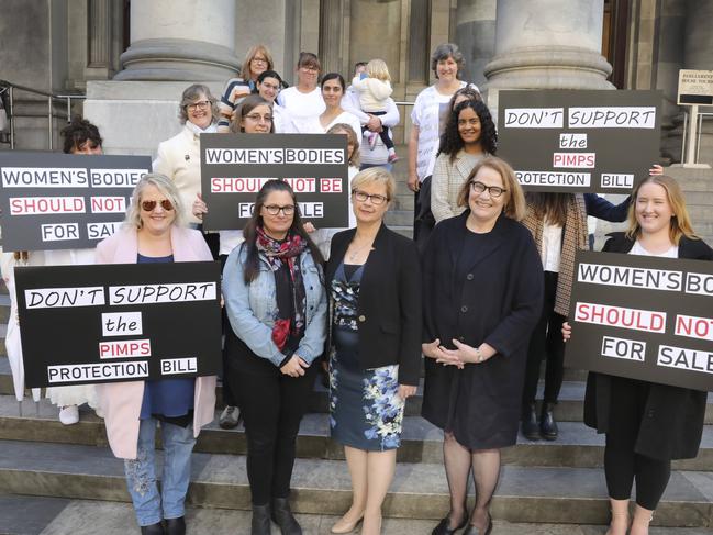 Protesters urge against the push to decriminalise sex work on the steps of Parliament House.