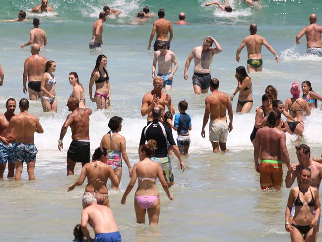 Summer holiday crowds at Bondi Beach.