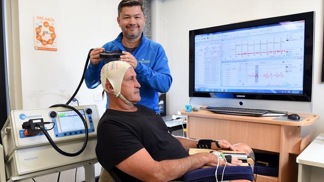 Former AFL player Rod Owen (sitting) is taking part in CTE research. Picture: Josie Hayden