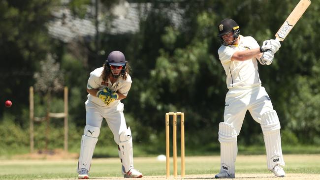 Tom Duxson cuts the ball away for Sunshine United. Picture: Hamish Blair